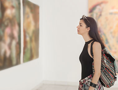 Girl looking at art in a gallery